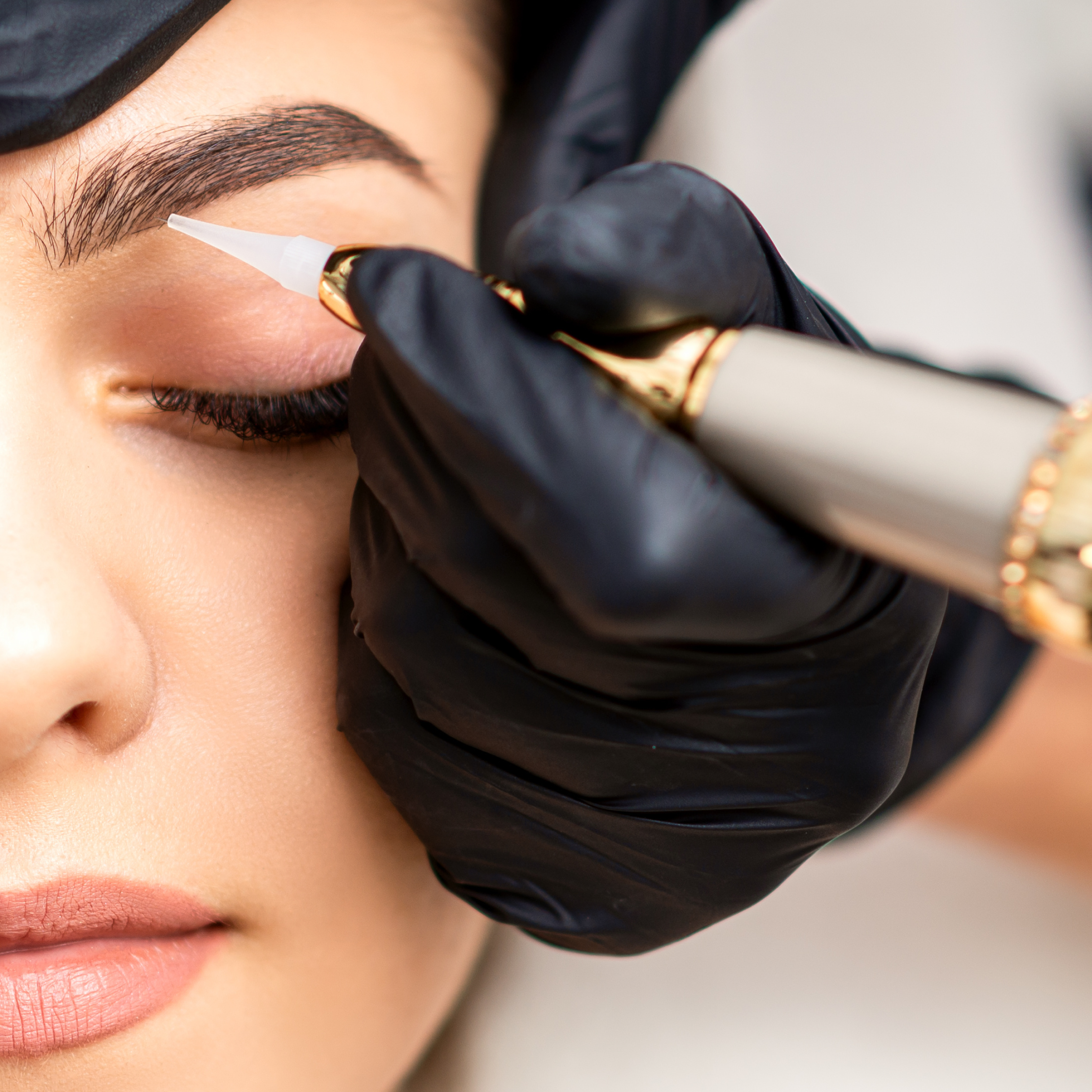 Woman receiving permanent makeup service